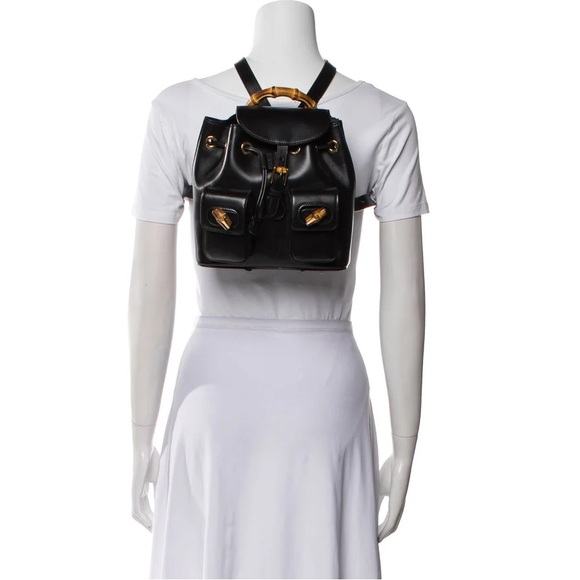 Gucci Handbags - Gucci Black Leather Backpack with Gold Accents